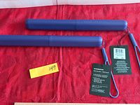 Two blue Starbucks travel cases with attached tags