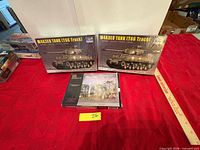 Two Hobby Boss tank kits and Pegasus figure set on table, overall lot view