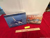 Front view of both boxed model kits on table