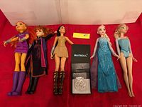 Group shot of all five dolls laid flat with Waitsoul jewelry box and chain