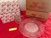 Overall lot showing boxed Fantasia cartons, one mug and one plate displayed
