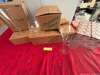 Group of boxed Princess House glassware with individual pieces displayed