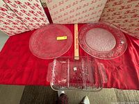 Overview of all three glass trays on red cloth