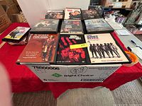 Top view of assorted single DVDs showing sample titles.