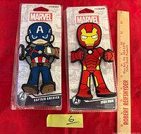 Captain America and Iron Man packaged phone holders side by side