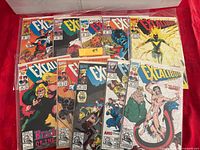 Front view showing all ten Excalibur comic books in protective bags