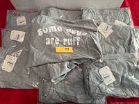 Top view showing printed text and quantity of shirts