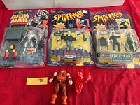 All four items displayed: three carded figures and loose Juggernaut