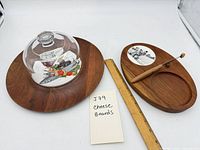 Both cheese boards, glass dome, knife, ruler for scale