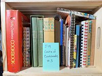 Full view of crate with all cookbooks