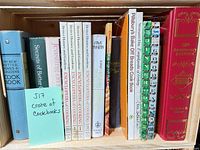 Entire row of cookbooks in wooden crate