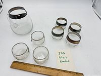 Group shot of pitcher and seven glasses