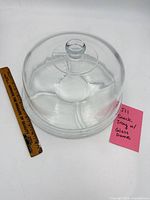 Tray with dome assembled beside ruler