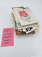 Stack of vintage holiday cards with note indicating quantity 70