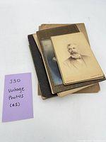 Stack of vintage cabinet photographs