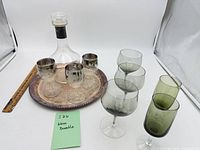 overview of entire lot with tray, decanter, nine glasses and ruler for scale