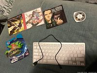 Overall lot with keyboard, CDs, PSP disc, Star Wars toy