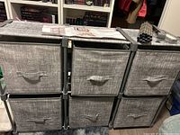 Front view of assembled modular shelf with six fabric bins