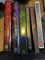 Spines of all six books showing titles and publishers