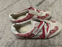 Left and right sneakers side view