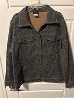 Full front view of jacket on hanger