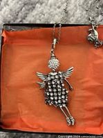 Angel rhinestone pendant necklace displayed in box