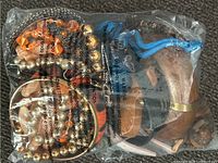 Front view of sealed bag showing multiple jewelry items