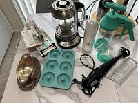 All eight kitchen gadgets arranged on countertop