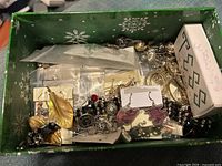 Overview of box with assorted jewellery pieces