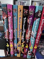 Spine view showing volumes 1-8, confirming title and volume numbers