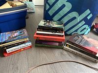 Overall view of three book stacks next to storage bins