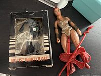 Overall view of both items: boxed robot and Teela figure with accessories