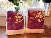 Front view showing two sealed Soft Loft 1-lb polyester fill bags