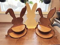 Two finished wood bunny shelves and one unfinished bunny stand
