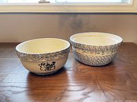 Two ironstone mixing bowls side by side showing exterior designs