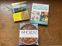 Group shot of all three cookbooks, covers visible