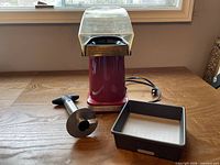 All three items: popcorn maker, corer, organizer