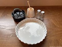 Group shot: Pampered Chef cutter, quiche pan, honey pot with dipper, salt and pepper shakers