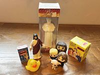 All eight novelty items grouped on wooden surface