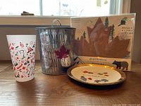 Group shot of all four items: ice bucket, cork board, tumbler, plate