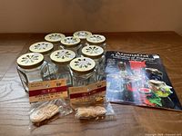 Lot overview showing jars, wicks, booklet