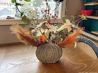 Front view galvanized pumpkin container with floral arrangement