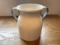 Front view of ceramic jug showing crackle glaze and handles