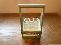 Front view of tote with two glass bottles inside