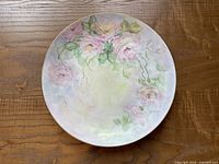 Close view of one hand-painted floral plate