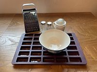 Group shot: silicone mould, sugar shaker, bowl, salt & pepper shakers, grater
