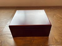 Closed mahogany finish humidor box front view