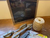 Message board, pulleys, twine, packaged spring
