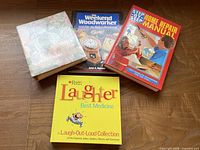 All four books front covers visible