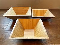 Three square bamboo bowls showing size differences